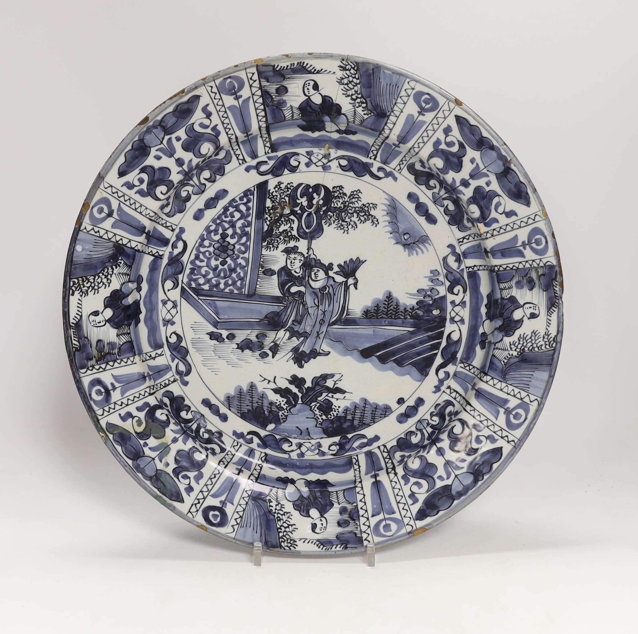 A Delft blue and white chinoiserie patterned dish, c.1700, 34cm diameter